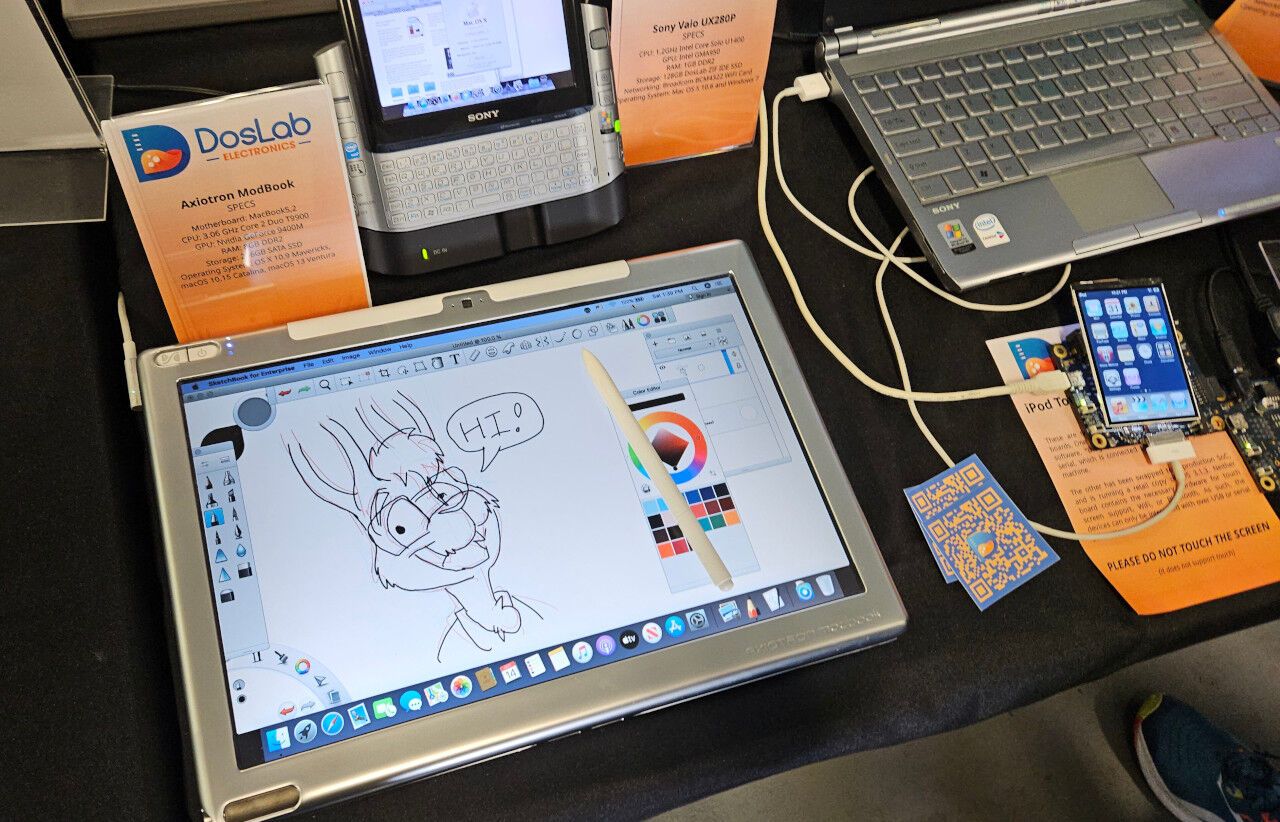 A tablet computer with a drawing of an anthropomorphic rabbit on it. A stylus sits on the computer.